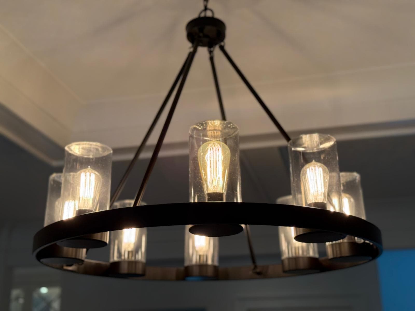 Clean wagon-wheel chandelier after detailed dusting